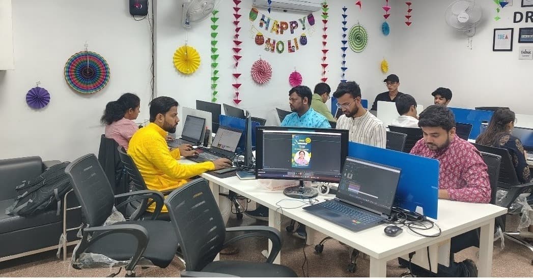 Team working in the office during Holi celebrations