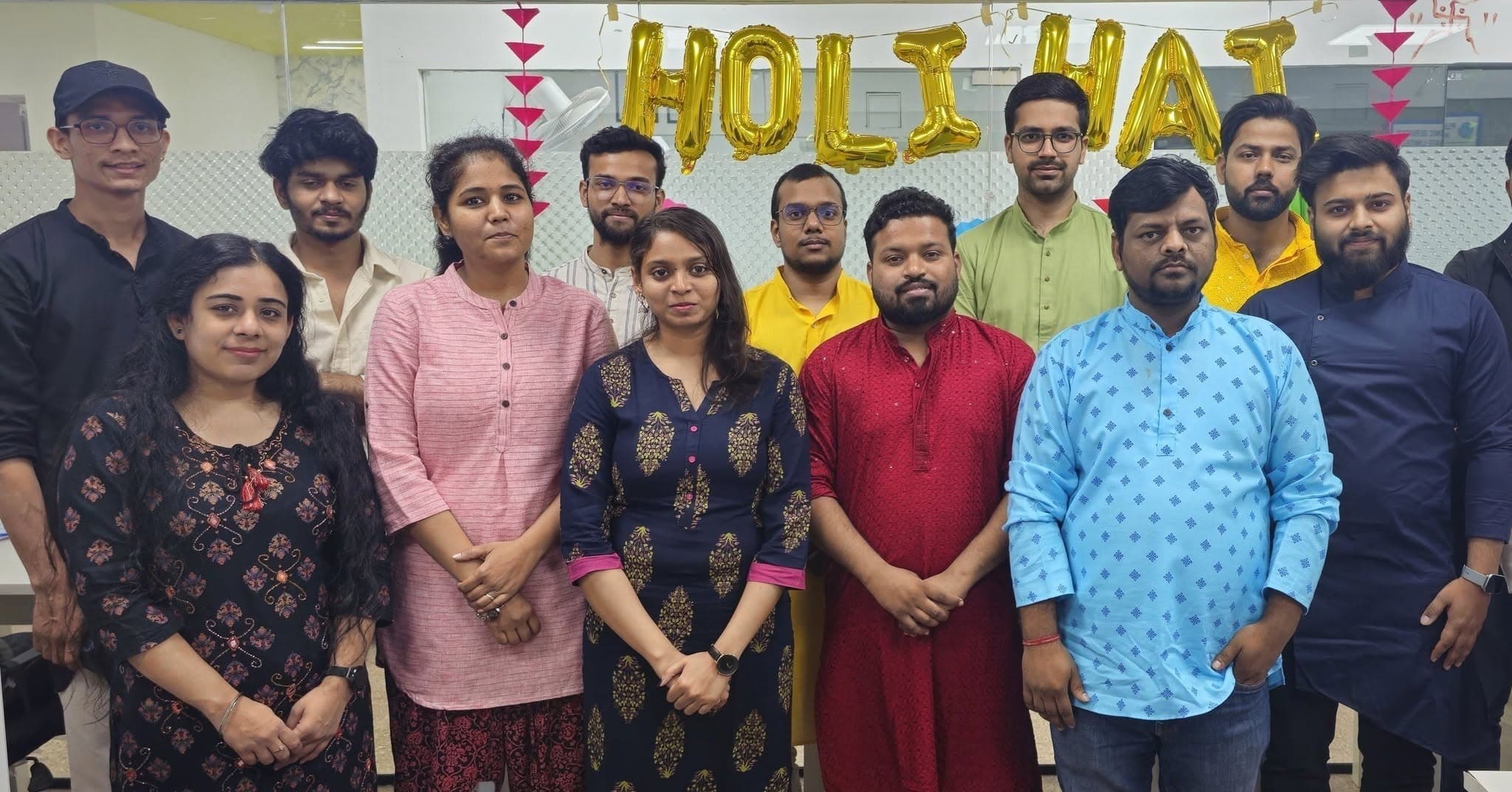 Plutonic team group photo with Holi Hai balloons
